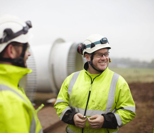Engineers having conversation at wind farm