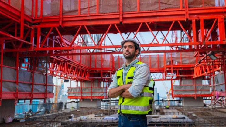 Portrait of an engineer designing a concrete floor and column st